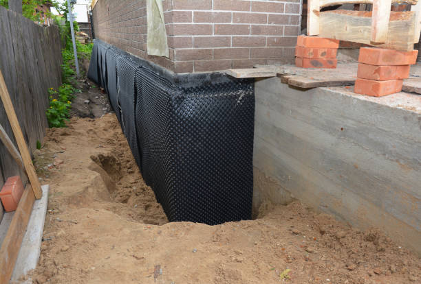 Happy homeowners after waterproofing job in Arrington